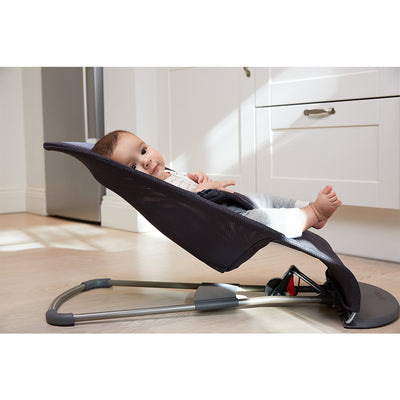 Side view of baby in BABYBJÖRN Bouncer Bliss in -- Color_Anthracite (Slate Gray) Mesh