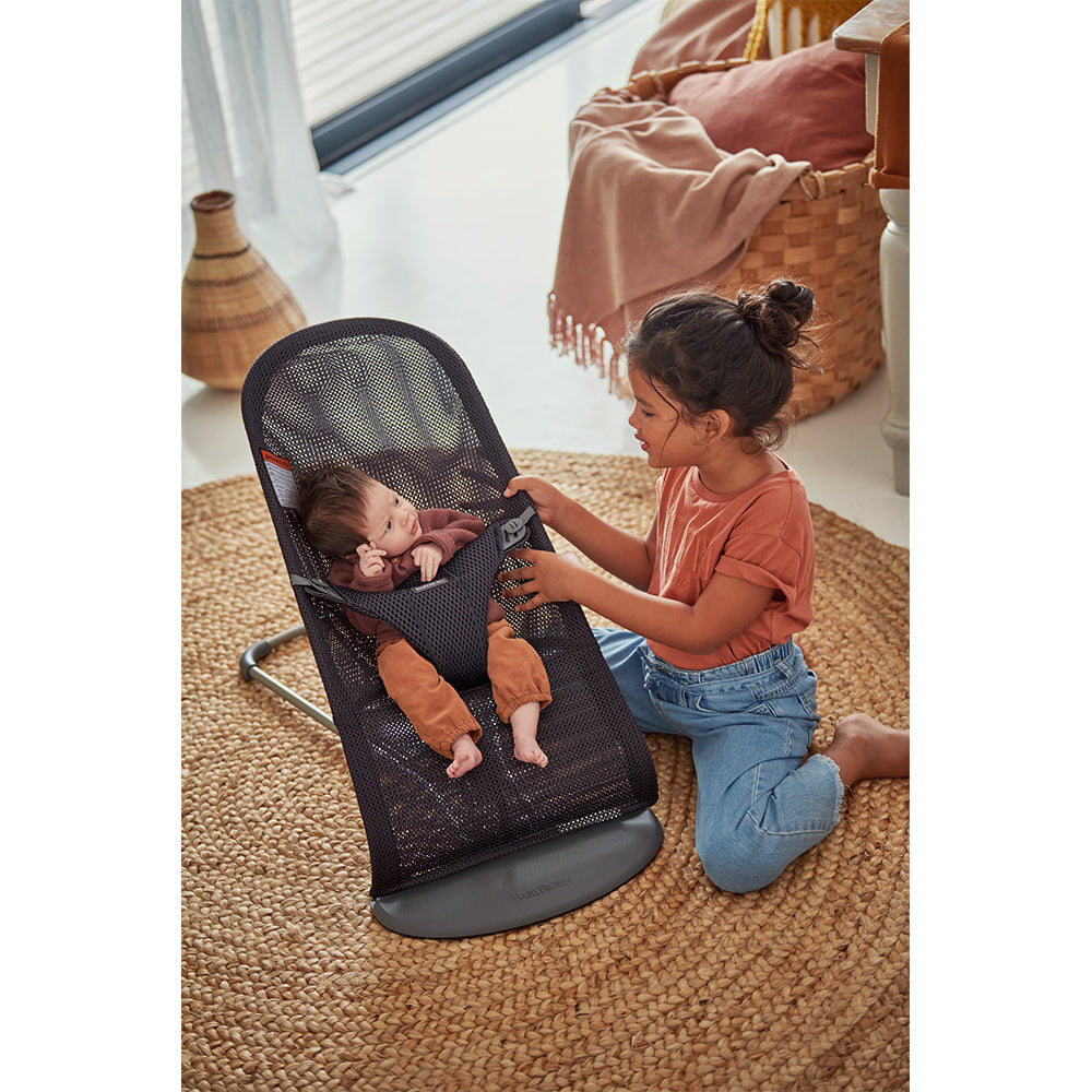 Baby in BABYBJÖRN Bouncer Bliss next to sister  in -- Color_Anthracite (Slate Gray) Mesh
