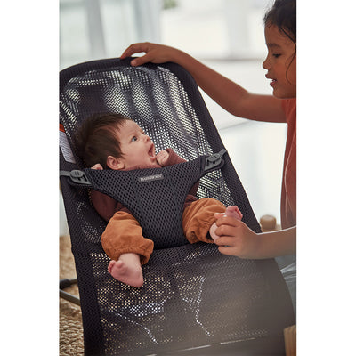 Baby yawning in the BABYBJÖRN Bouncer Bliss in -- Color_Anthracite (Slate Gray) Mesh