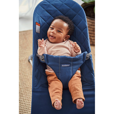 Baby laughing in BABYBJÖRN Bouncer Bliss in -- Color_Midnight Blue Woven, Classic Quilt