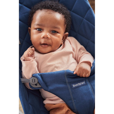 Baby relaxing in BABYBJÖRN Bouncer Bliss in -- Color_Midnight Blue Woven, Classic Quilt