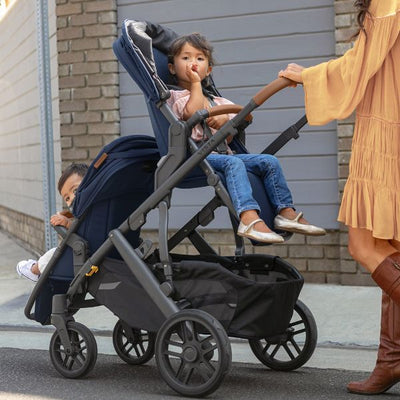 Two Children Riding in Convertible UPPAbaby VISTA V2 Stroller
