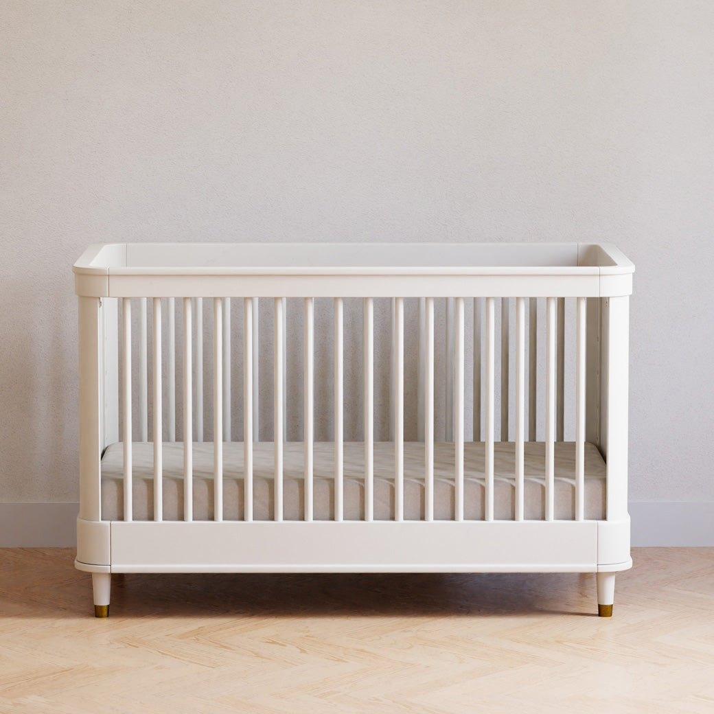 Front view of Namesake's Tanner 3-in-1 Convertible Crib in a room 