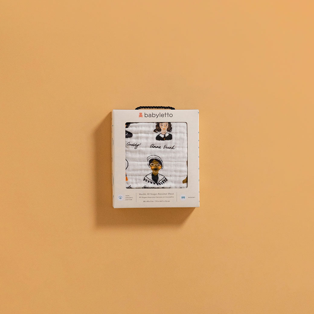 The packaging of the Babyletto All-Stages Bassinet Sheet In GOTS Certified Organic Muslin Cotton in -- Color_Women In History