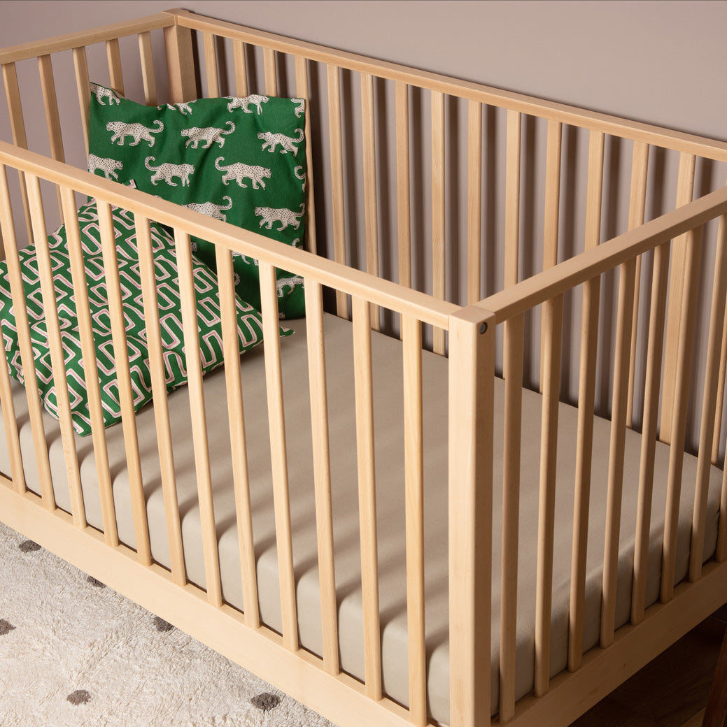 Dadada Lala 3-in-1 Convertible Crib with green pillows  in - Color_Natural