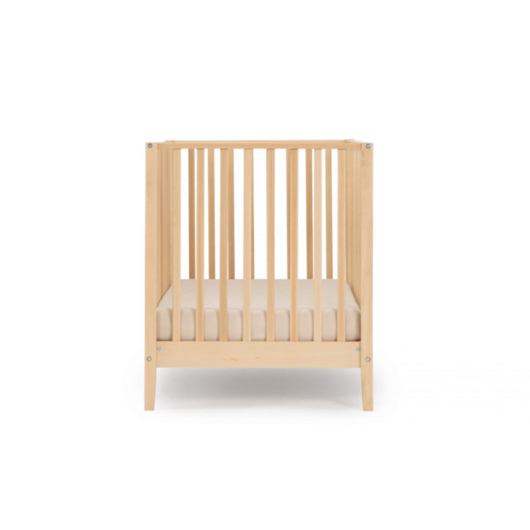 Side view of Dadada Lala 3-in-1 Convertible Crib in - Color_Natural