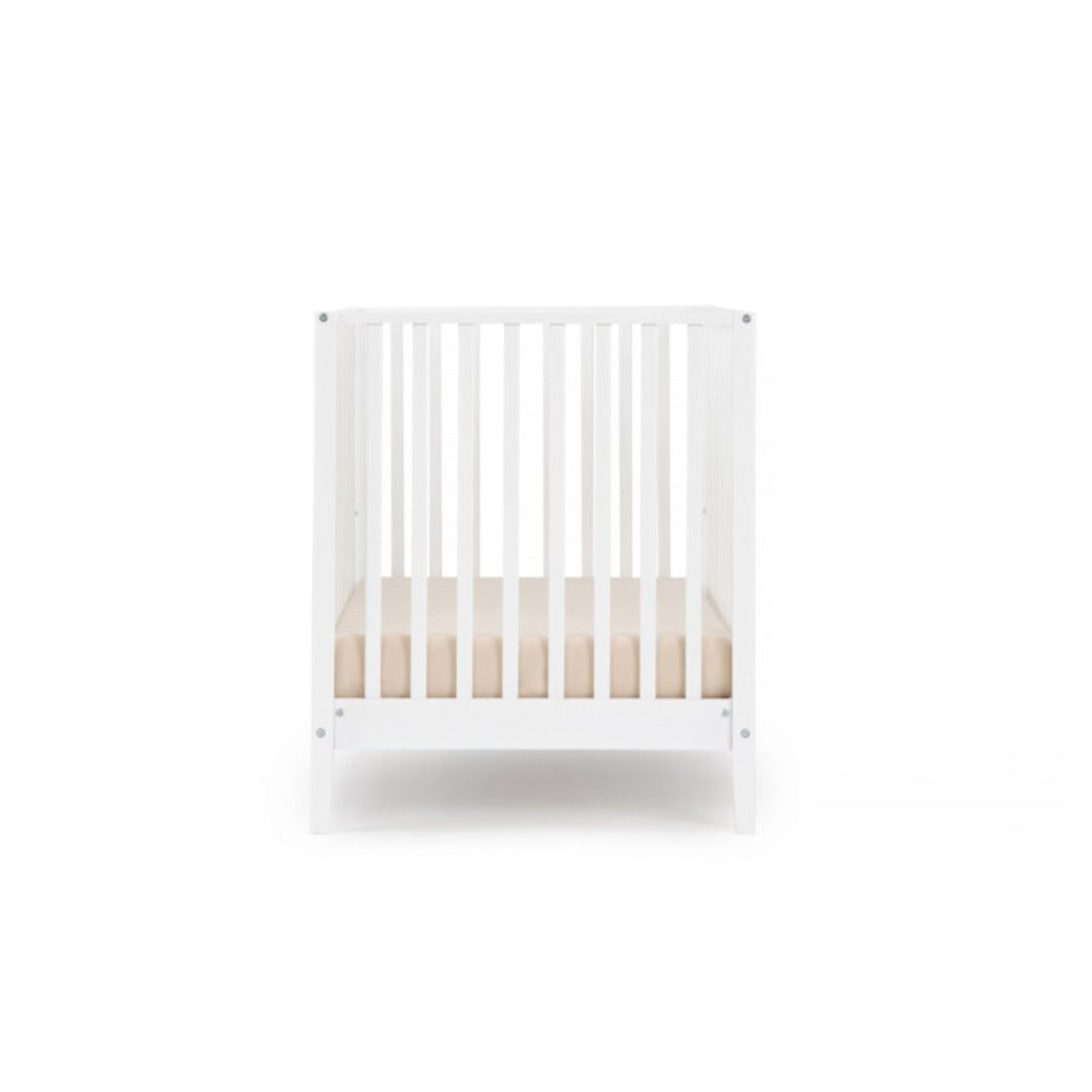 Side view of Dadada Lala 3-in-1 Convertible Crib in - Color_White