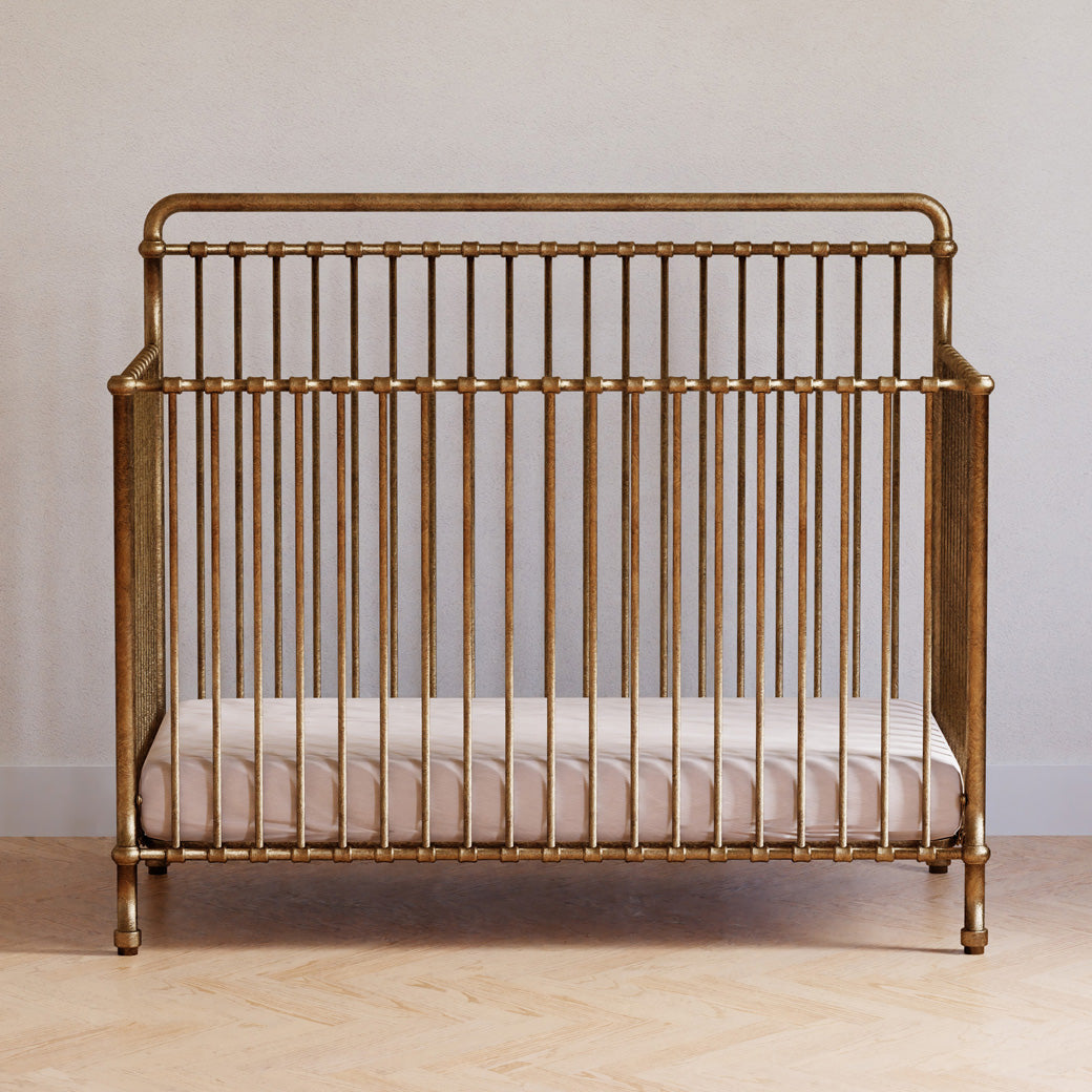 Front view of Namesake's Winston 4 in 1 Convertible Crib in a room in -- Color_Vintage Gold