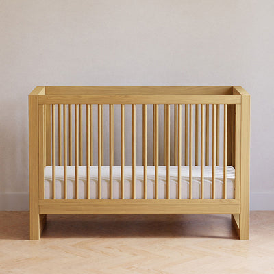 Front view of Namesake's Nantucket 3-in-1 Convertible Crib in a room  in -- Color_Honey