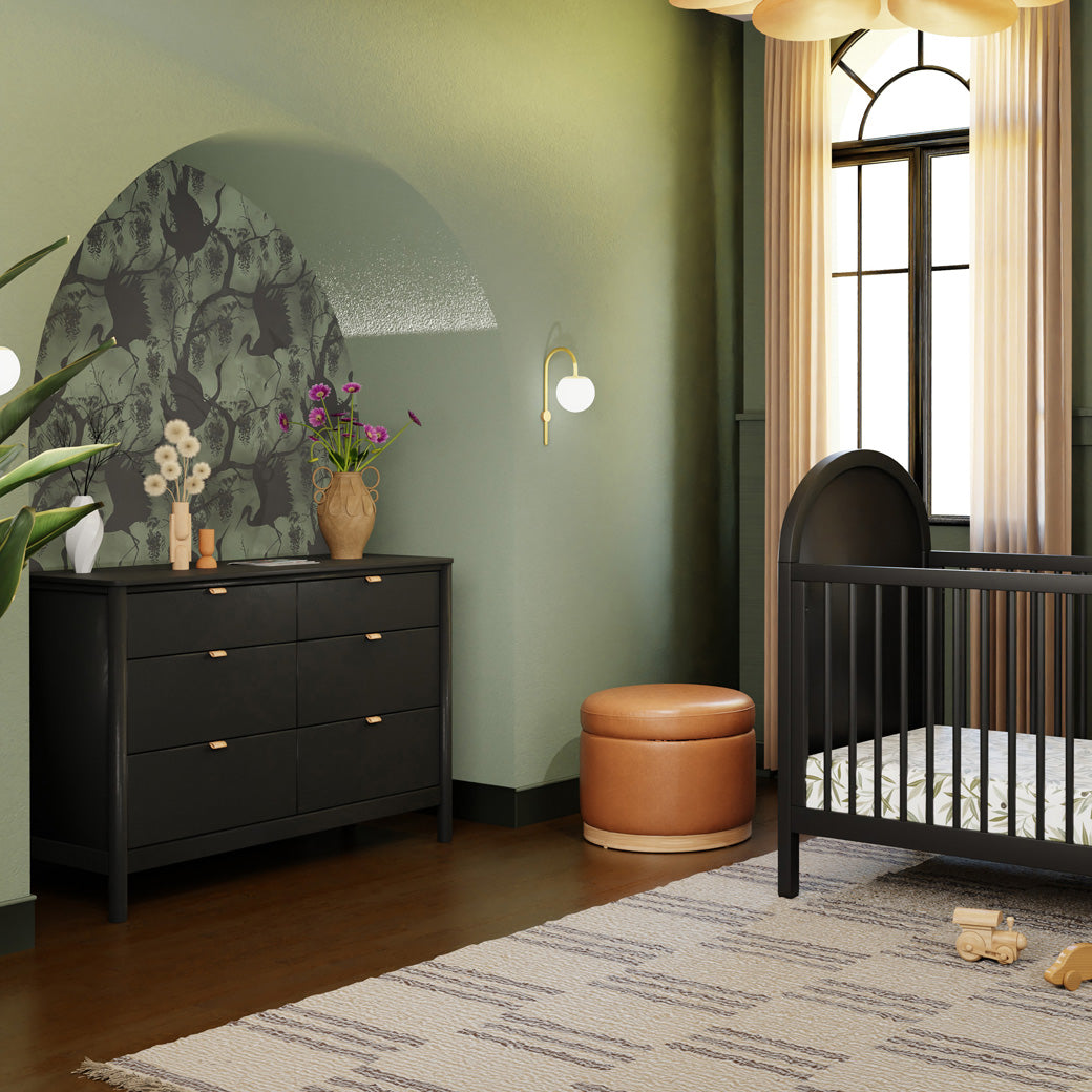 Babyletto Bondi 6-Drawer Dresser  next to ottoman and crib in -- Color_Black