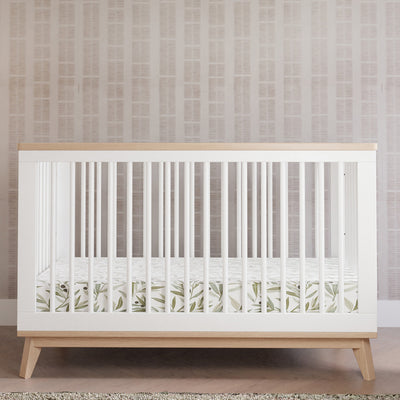 Front view of Babyletto's Scoot 3-in-1 Convertible Crib + Toddler Rail with Babyletto bedding in -- Color_Washed Natural/White
