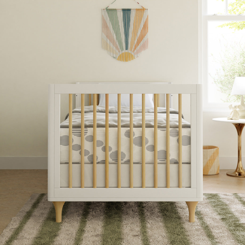 Front view of The Babyletto Lolly 4-in-1 Convertible Mini Crib as a full-size bed in -- Color_White / Natural