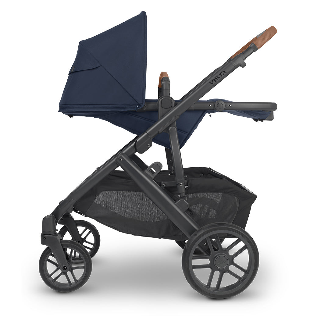 Side view of reversed UPPAbaby VISTA V2 Stroller fully reclined in -- Color_Noa