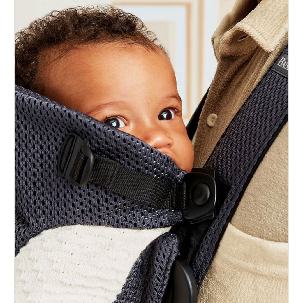 Closeup of baby in BABYBJÖRN Baby Carrier Mini in -- Color_Anthracite (Slate Gray) 3D Mesh
