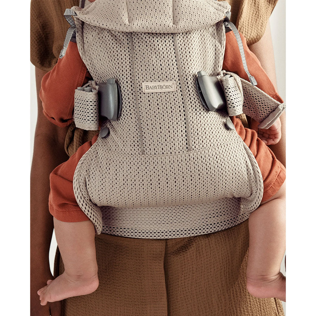 Closeup of the back of Babybjorn Baby Carrier One with baby in -- Color_Gray Beige 3D Mesh Air