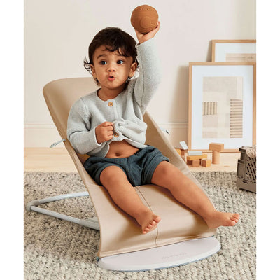 Toddler sitting in BABYBJÖRN Bouncer Balance Soft in -- Color_Beige/Gray Woven/Jersey