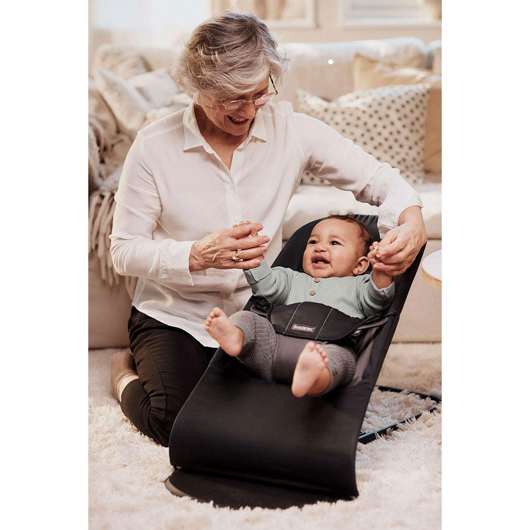 Grandma playing with baby in Baby in BABYBJÖRN Bouncer Balance Soft in -- Color_Black/Dark Grey Woven