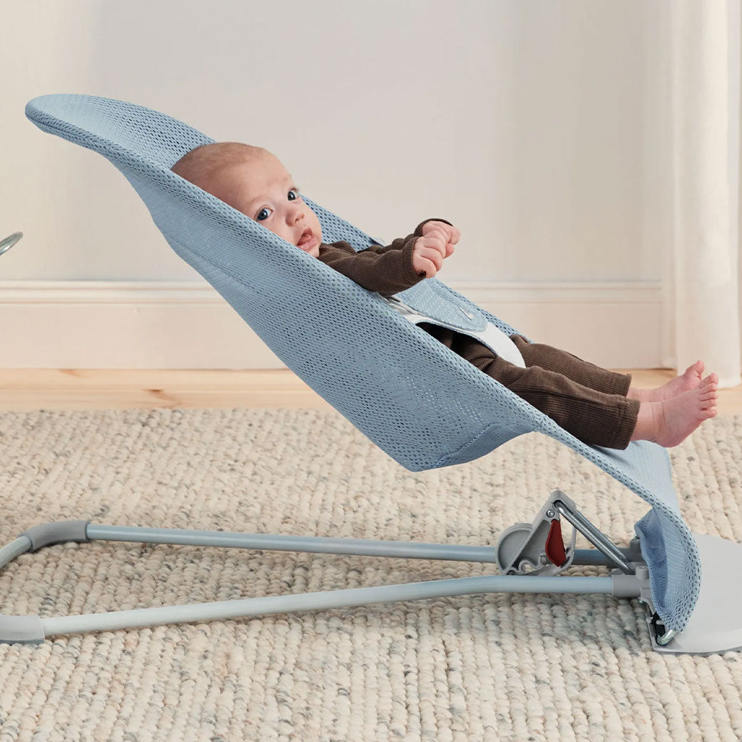 Side view of baby in BABYBJÖRN Bouncer Balance Soft in -- Color_Sky Blue/White Mesh