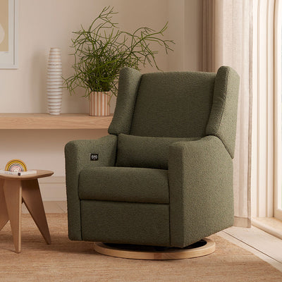 Babyletto Kiwi Glider Recliner next to a window and table in -- Color_Olive Boucle With Light Base