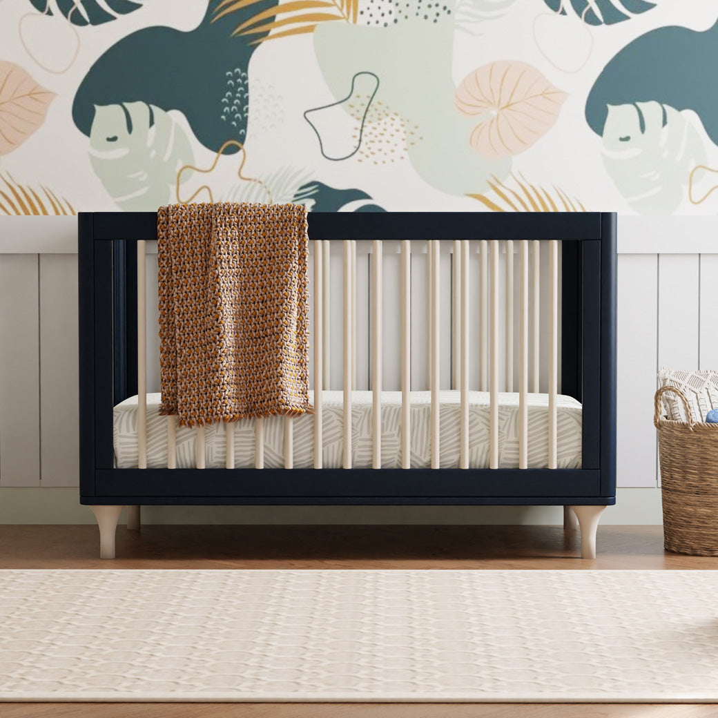 Front view of The Babyletto Lolly 3-in-1 Crib with blanket on rail  in -- Color_Navy