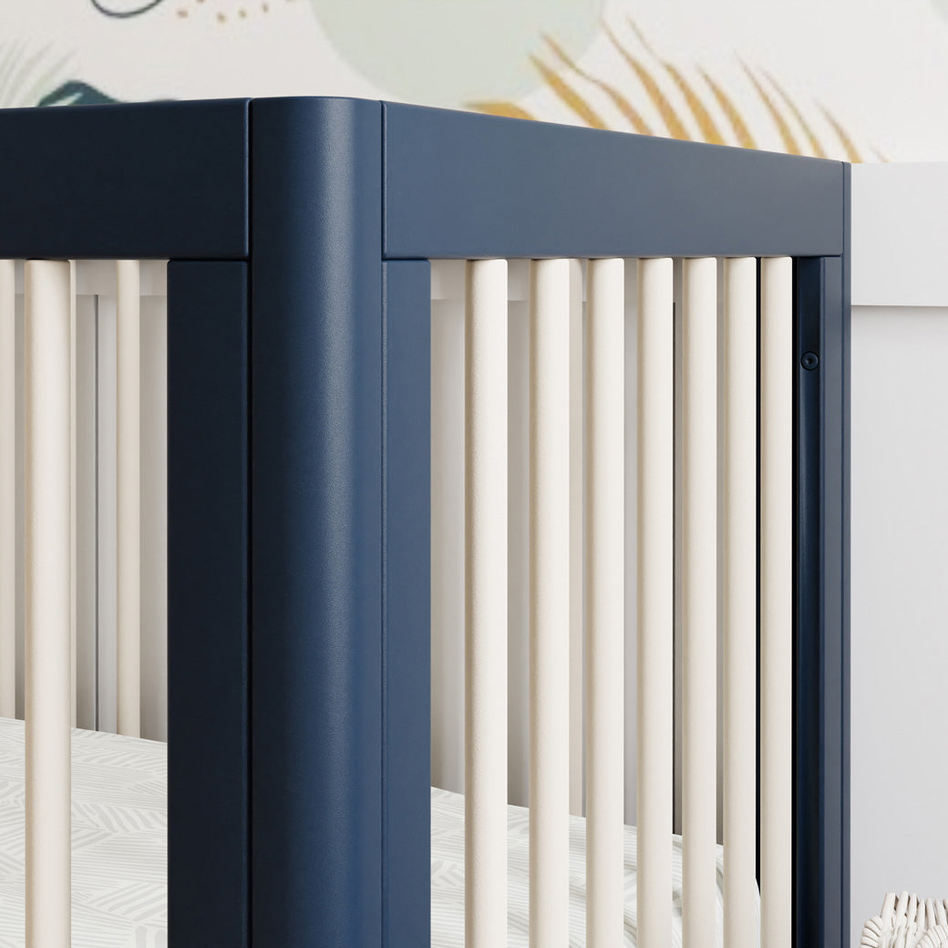 Closeup of the rail of The Babyletto Lolly 3-in-1 Crib in -- Color_Navy