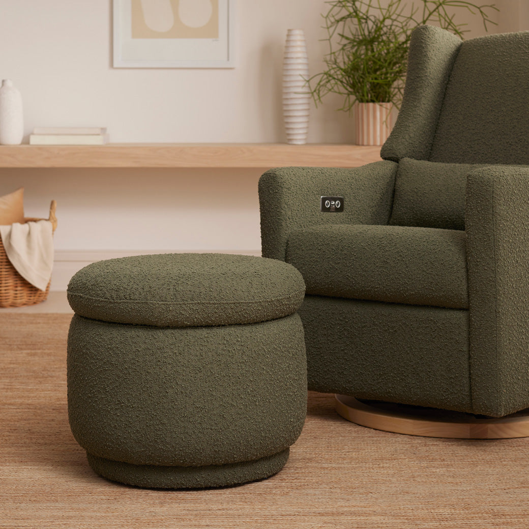 The Babyletto Enoki Storage Ottoman next to a recliner  in --Color_Olive Boucle