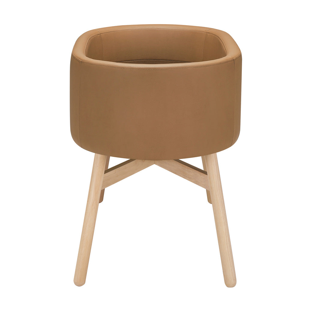 Side view of Babyletto GATHRE Capsule Bassinet in -- Color_Camel