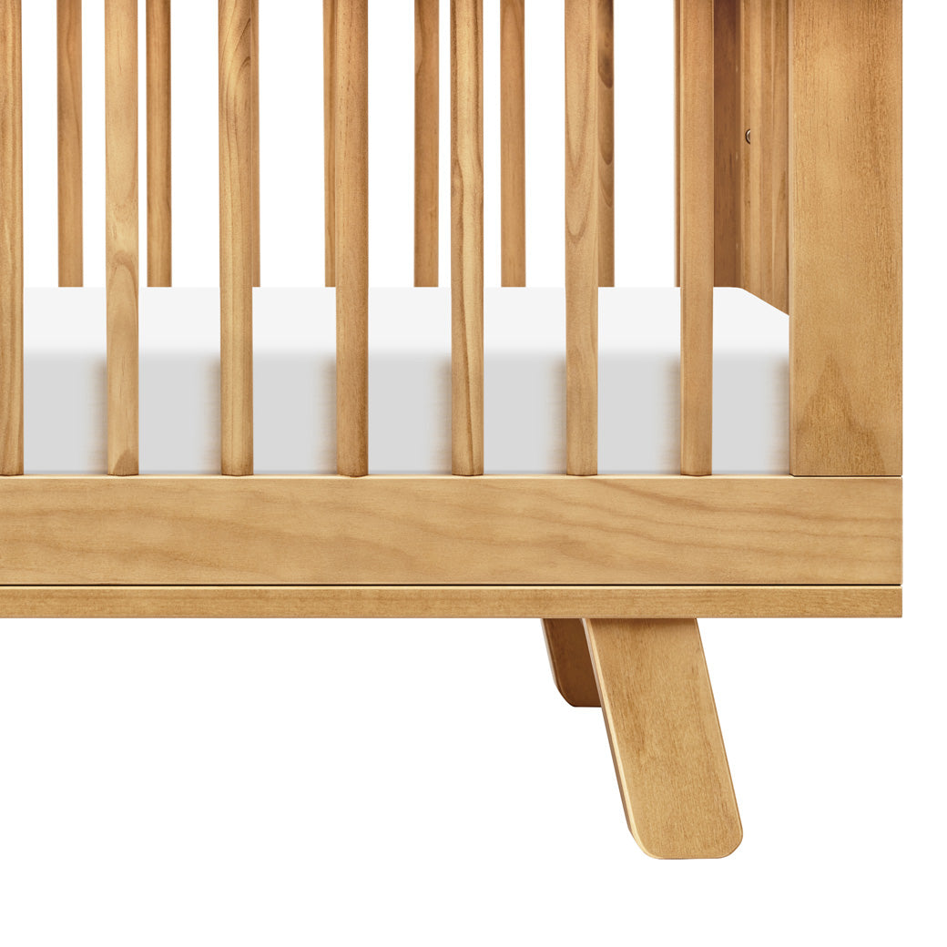 Closeup of Babyletto Hudson 3-in-1 Convertible Crib And Toddler Rail leg in -- Color_Honey