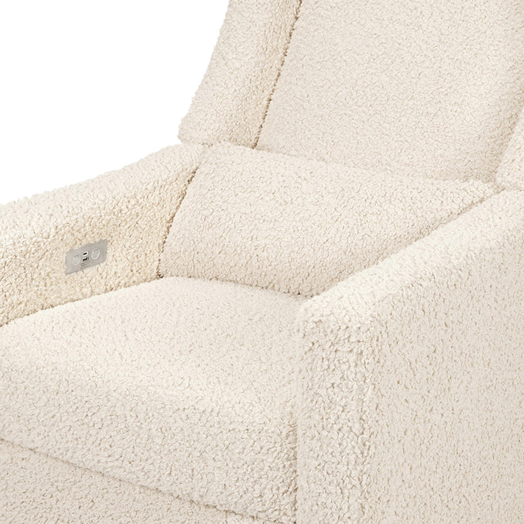 Closeup of Babyletto Kiwi Glider Recliner in -- Color_Almond Teddy Loop with Light Wood Base