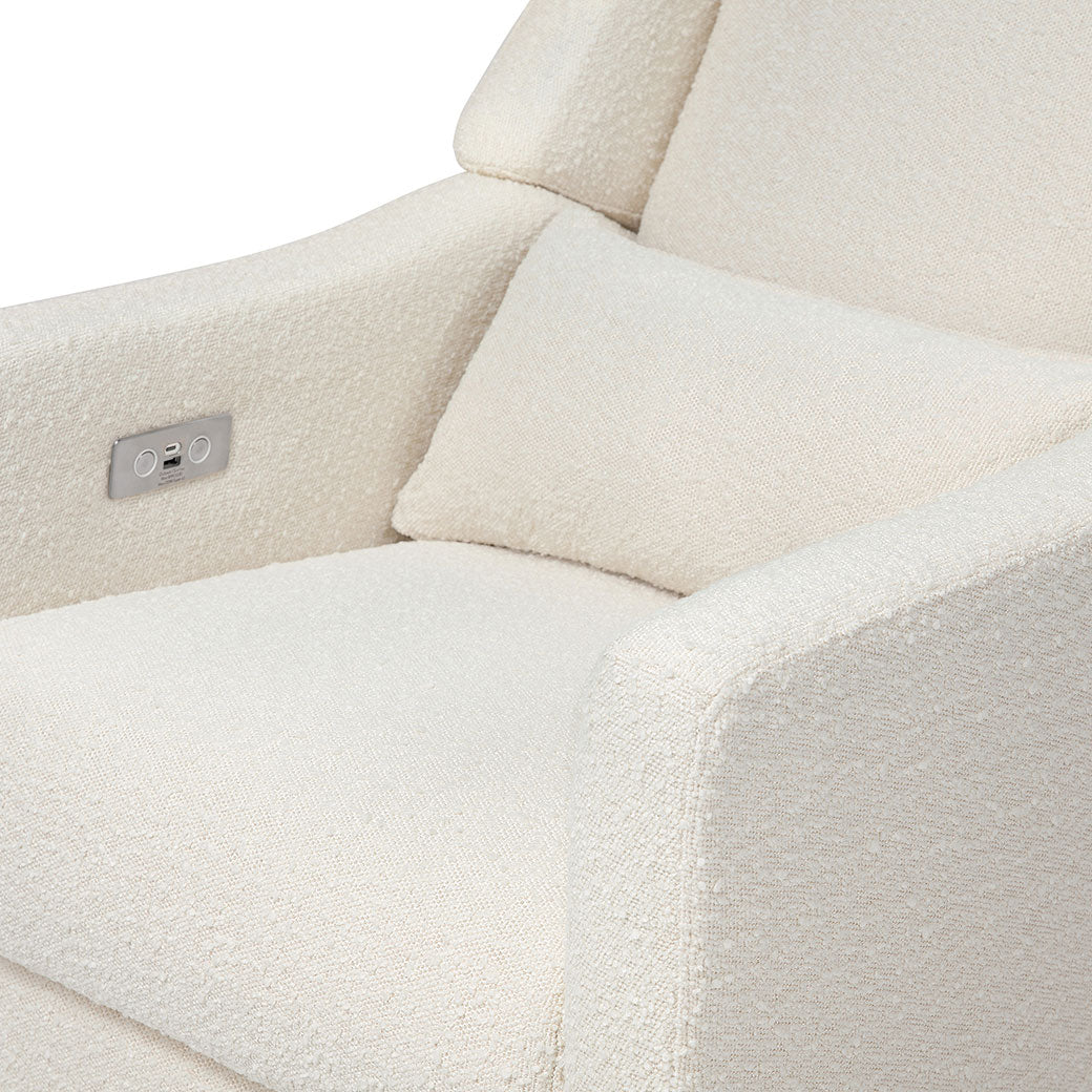 Closeup view of the seat of the Babyletto Kiwi Glider Recliner in -- Color_Ivory Boucle with Gold Base