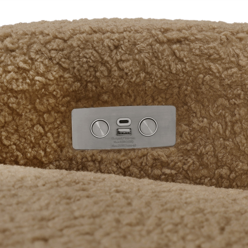 Closeup of USB port of Babyletto Nami Glider Recliner in -- Color_Cortado Shearling with Light Wood Base