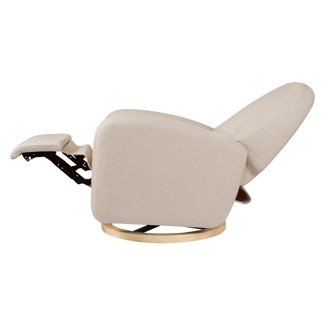Side view of fully reclined The Babyletto Nami Glider Recliner in -- Color_Performance Beach Eco-Weave with Light Wood Base