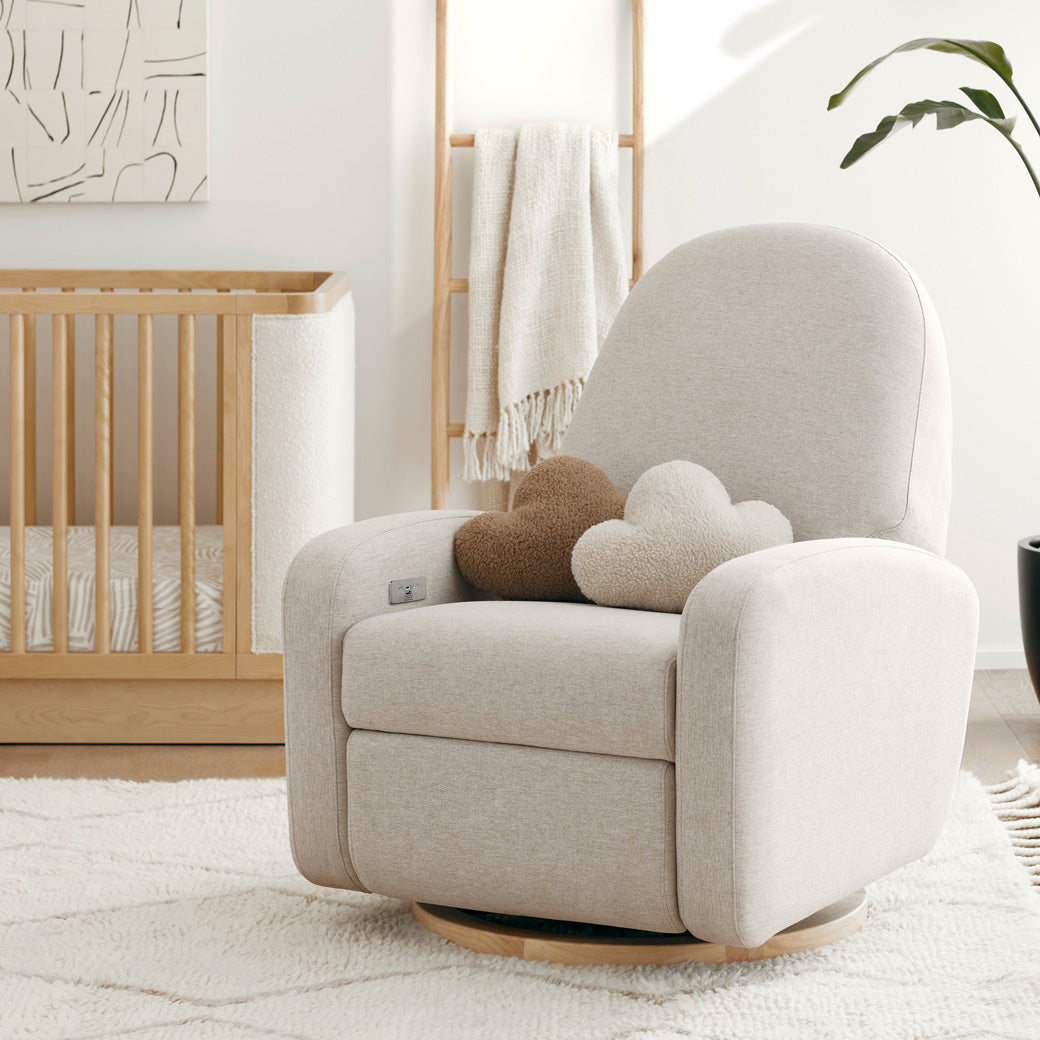 The Babyletto Nami Glider Recliner with cloud pillows on the seat  in -- Color_Performance Beach Eco-Weave with Light Wood Base