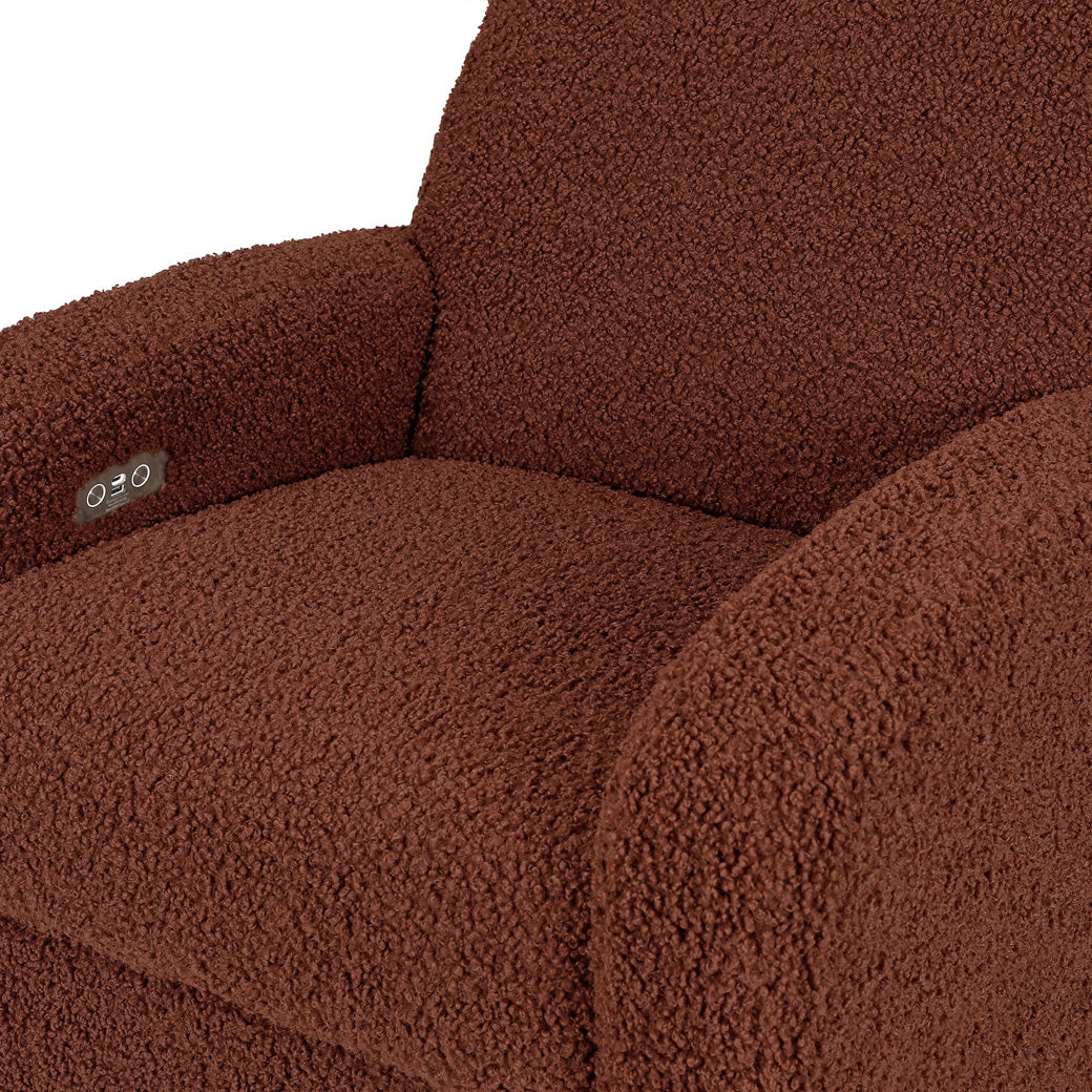 Closeup of the seat of Babyletto Nami Glider Recliner in -- Color_Rouge Teddy Loop with Light Wood Base