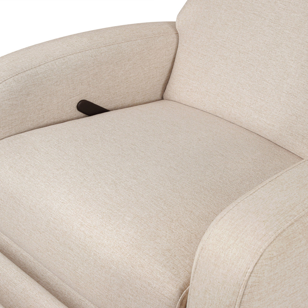 Closeup of the seat of the Babyletto Nami Glider Recliner in -- Color_Performance Beach Eco-Weave with Light Wood Base