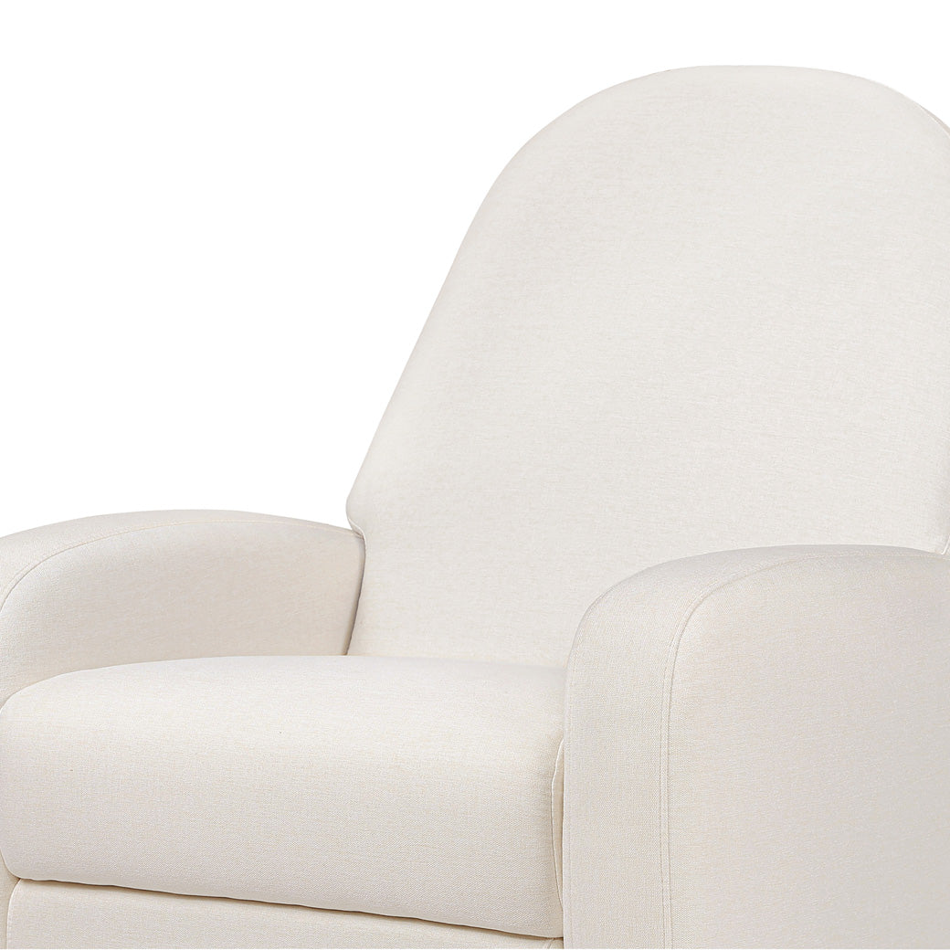 Closeup view of the seat of the Babyletto Nami Glider Recliner in -- Color_Performance Cream Eco-Weave with Light Wood Base