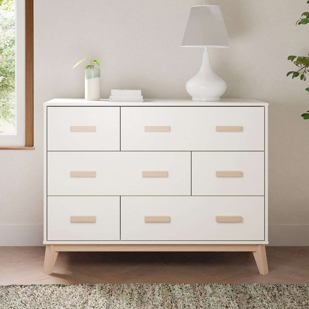 Front view of Babyletto Scoot 6-Drawer Dresser with lamp and items on top in -- Color_White / Washed Natural