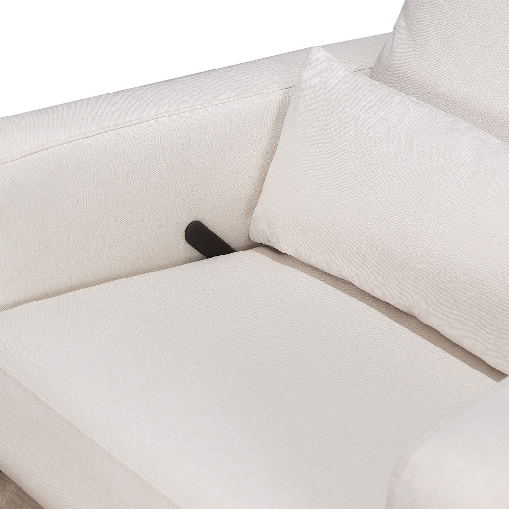 Closeup of the seat of Babyletto Sigi Glider Recliner in -- Color_Performance Cream Eco-Weave with Light Wood Base