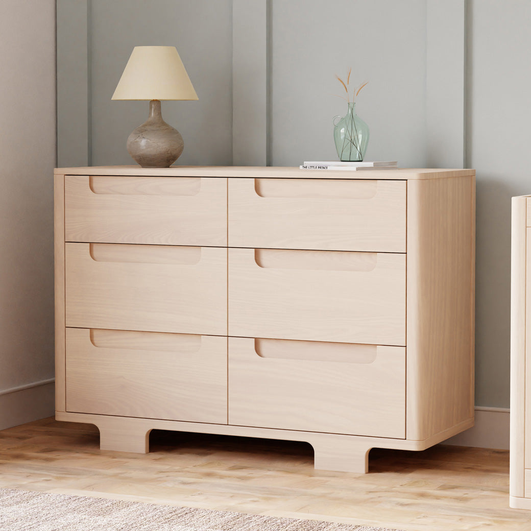 Babyletto Yuzu 6-Drawer Dresser with a lamp and vase on top  in -- Color_Washed Natural