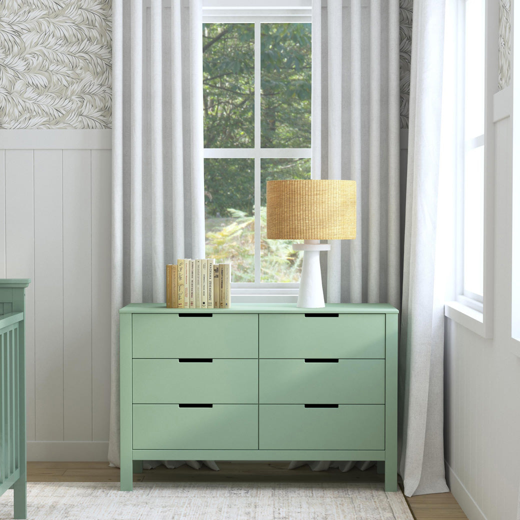Front view of Carter's by DaVinci Colby 6-Drawer Dresser under a window in -- Color_Light Sage