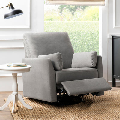 Carter's by DaVinci Ethan Recliner and Swivel Glider next to a coffee table with the footrest slightly up  in -- Color_Performance Grey Linen