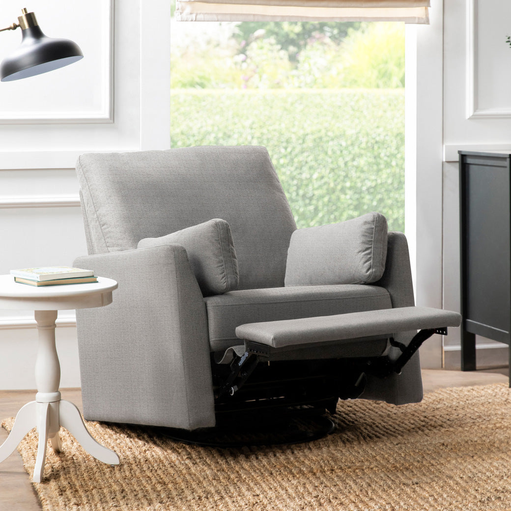 Carter's by DaVinci Ethan Recliner and Swivel Glider in a room with the footrest up in -- Color_Performance Grey Linen