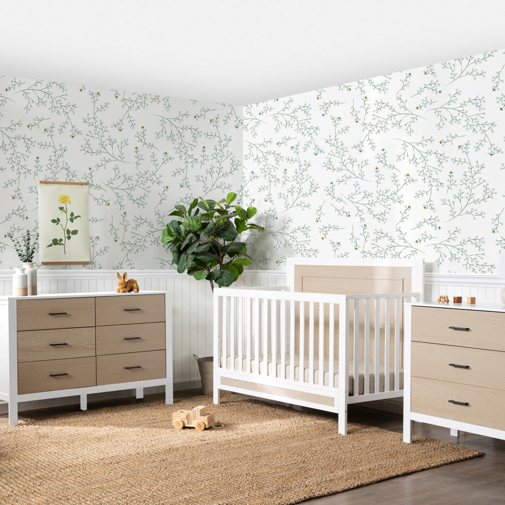 Carter's by DaVinci Radley 4-in-1 Convertible Crib next to a 6-drawer dresser and a 3-drawer dresser in -- Color_White/Coastwood