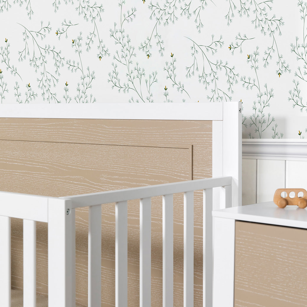 Carter's by DaVinci Radley 4-in-1 Convertible Crib closeup of rails next to a dresser  in -- Color_White/Coastwood