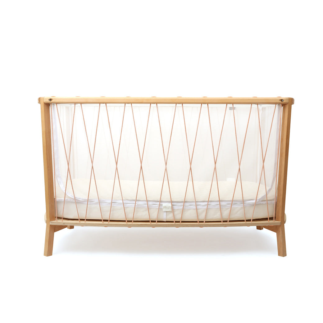 Front view of Charlie Crane KIMI Baby Bed in -- Color_Bois de Rose