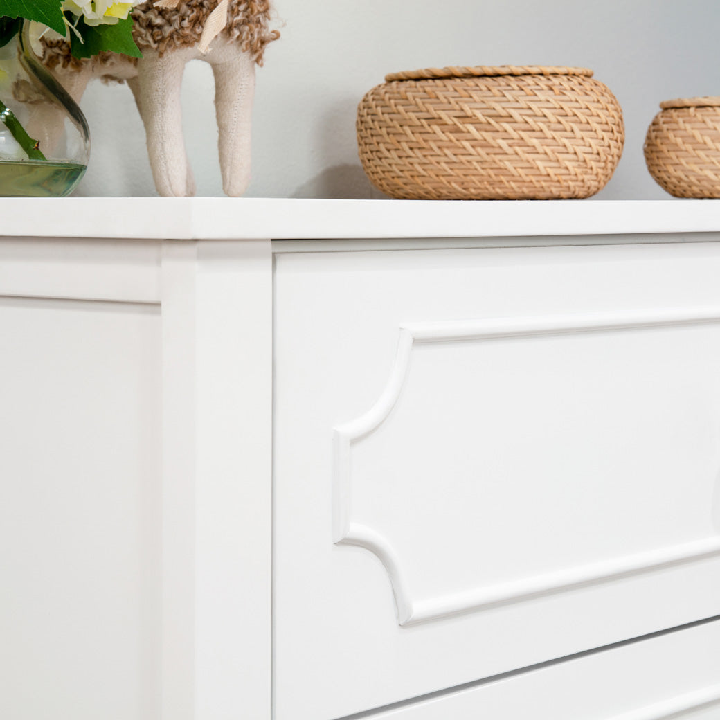 Closeup of the DaVinci Chloe Regency 3-Drawer Dresser decoration on top in -- Color_White