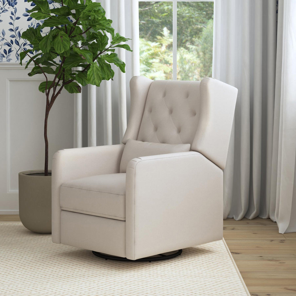 DaVinci Everly Recliner and Swivel Glider next to a plant and window in -- Color_Performance Cream Eco-Weave