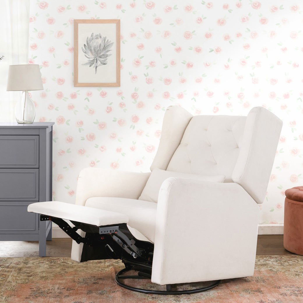 Reclined DaVinci Everly Recliner and Swivel Glider next to a dresser and ottoman  in -- Color_Performance Cream Eco-Weave