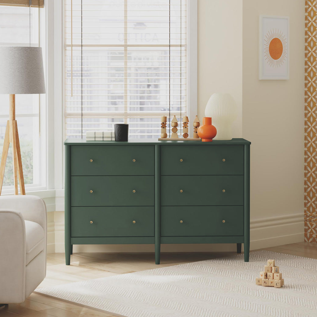 Front view of DaVinci Frem 6-Drawer Dresser next to window and recliner  in -- Color_Forest Green