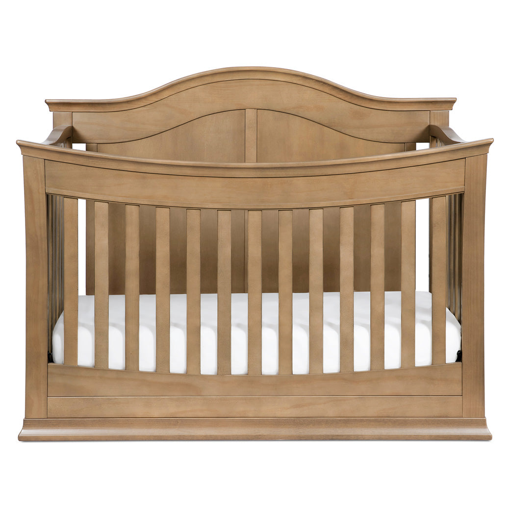 Front view of DaVinci Meadow 4-in-1 Convertible Crib in -- Color_Hazelnut
